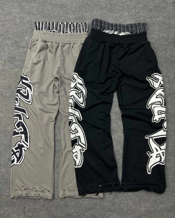 Layered Waist Graffiti Print Distressed Flared Sweatpants Layered Waist Graffiti Print Distressed Flared Sweatpants